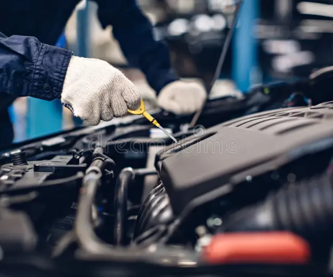 auto-car-repair-service-center-mechanic-checking-engine-oil-level-auto-car-repair-service-center-mechanic-checking-engine-oil-166202634